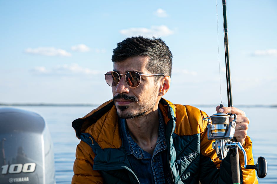 Angler wearing polarized sunglasses fishing at a lake