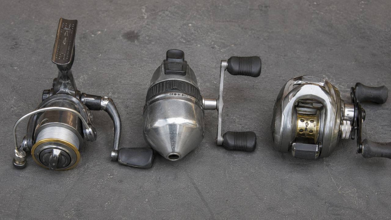 Close-up comparison of spinning, spincast, and baitcasting fishing reels showing their different designs