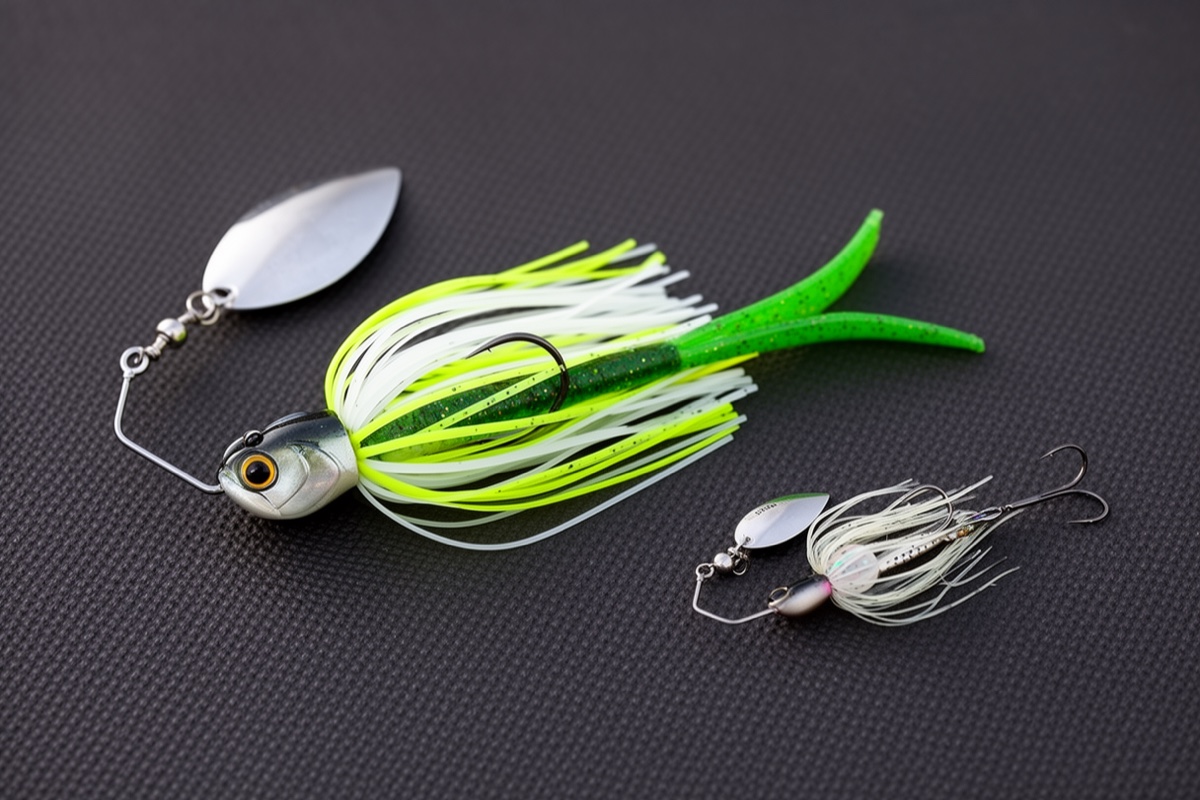 Spinnerbait rigged with a paddle-tail swimbait trailer behind the skirt, shown next to a bare spinnerbait for comparison
