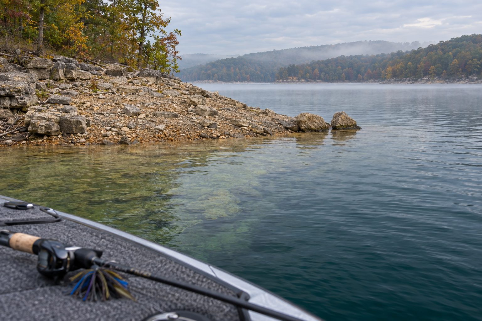 Rocky point sloping into deep water on a calm fall morning